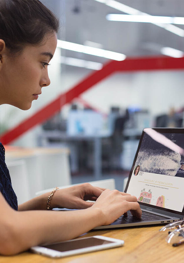 pics-_0001_mockup-of-a-girl-working-with-a-macbook-on-a-wooden-desk-a21446